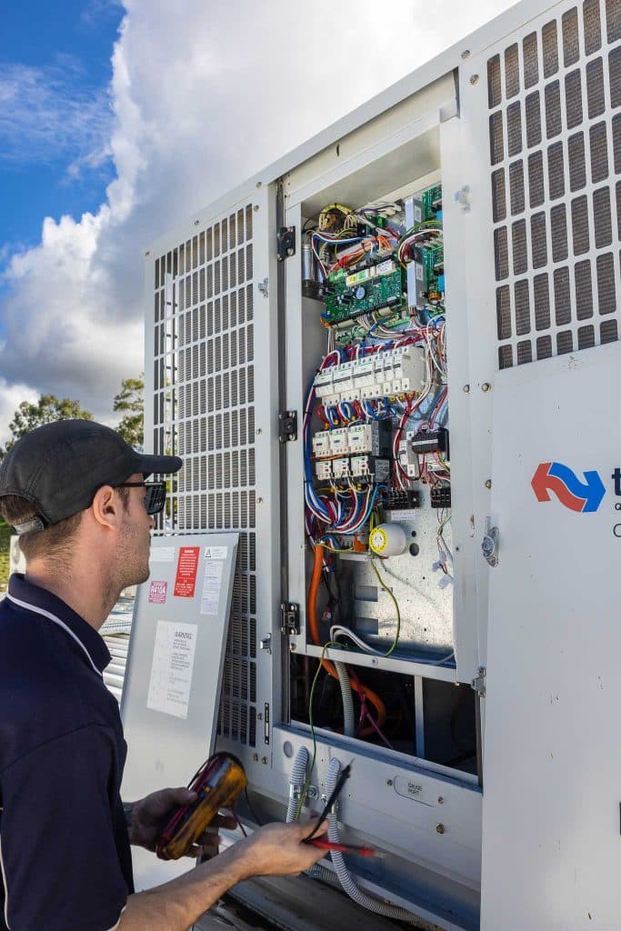 Electrician inspecting a circuit board