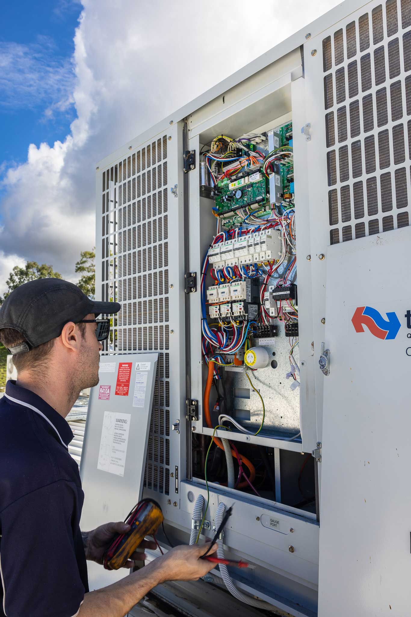 Electrician inspecting a circuit board