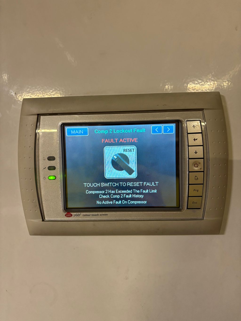 Chiller controller screen displaying a compressor lockout fault message.