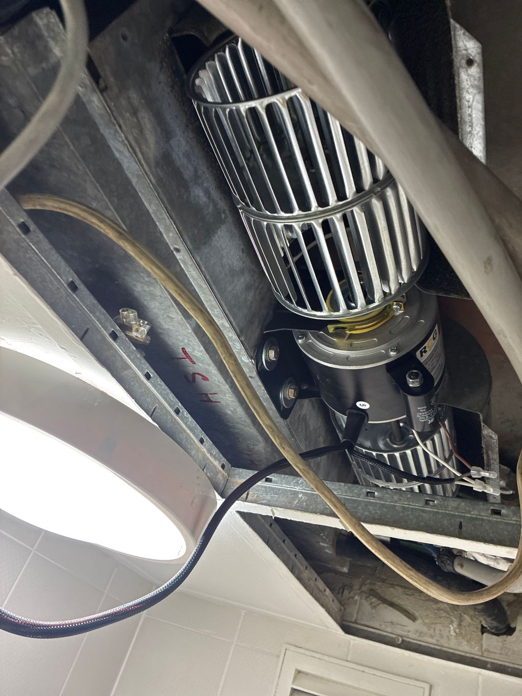 Replacement fan motor installed inside an air handling unit.