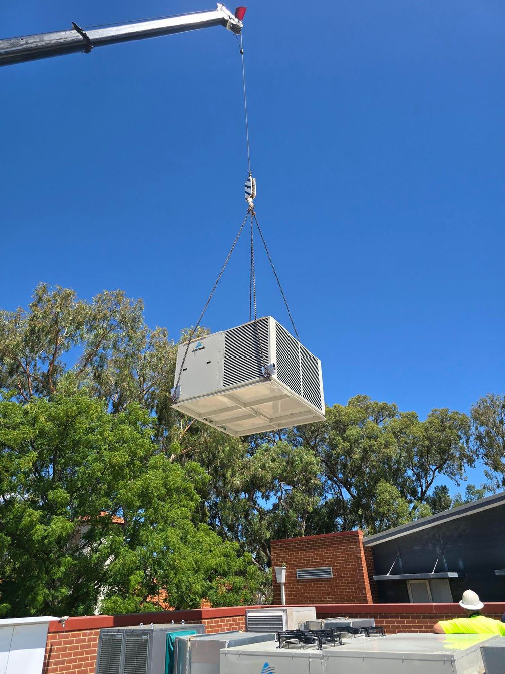 HVAC unit is lifting by a crane