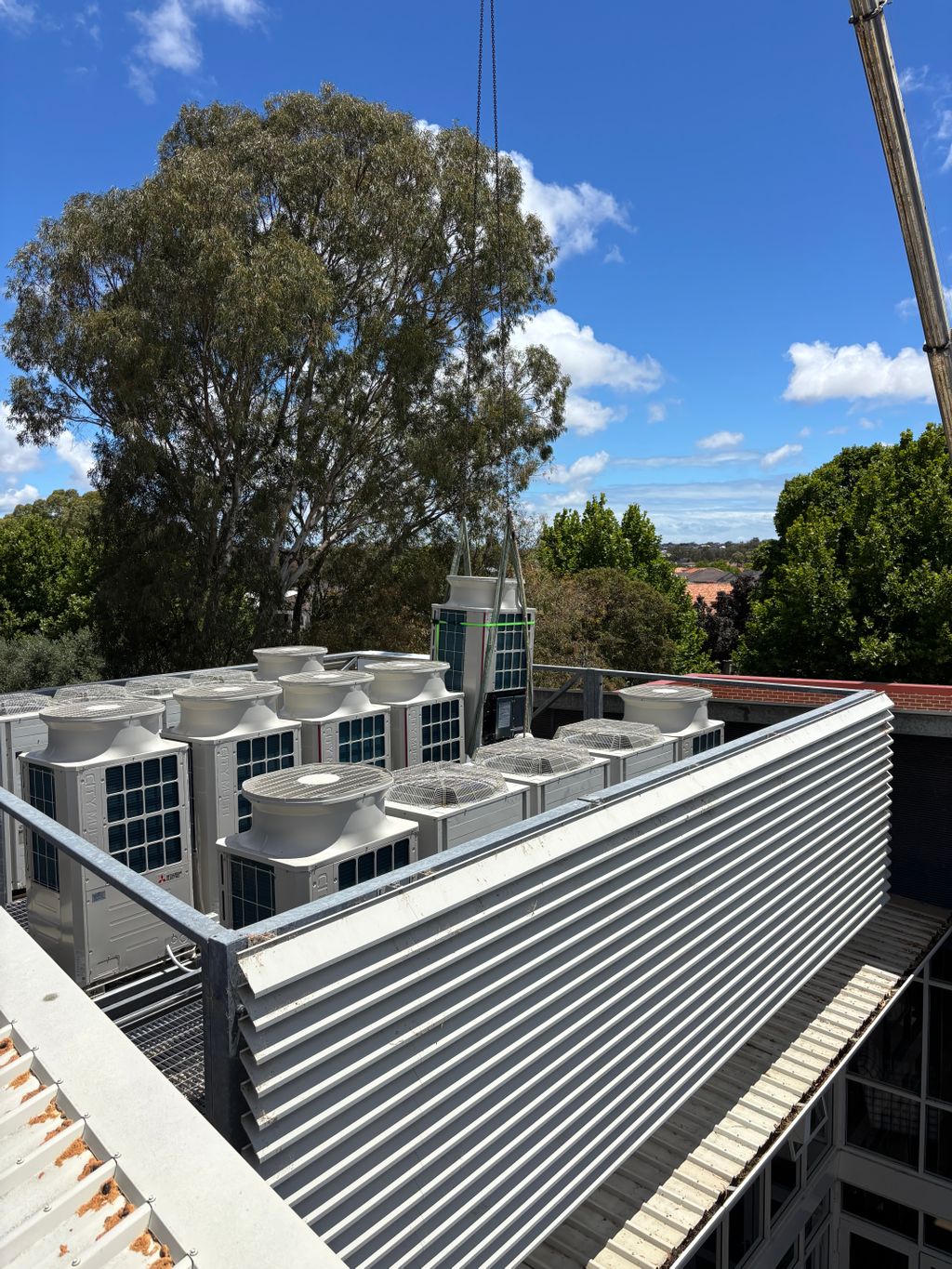 cranes transport equipment to the roof