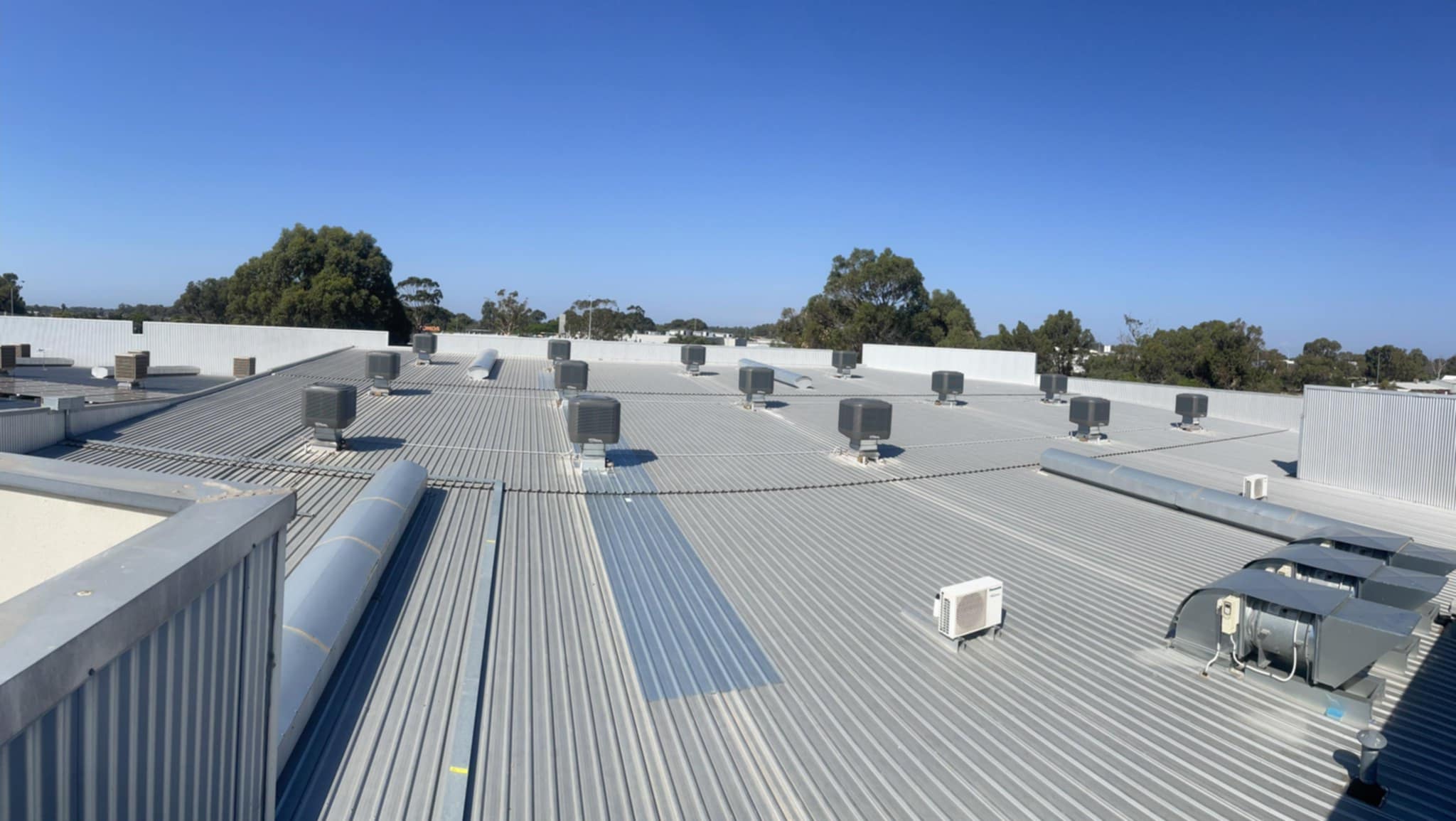 A Colorbond roof with built-in air conditioning equipment.