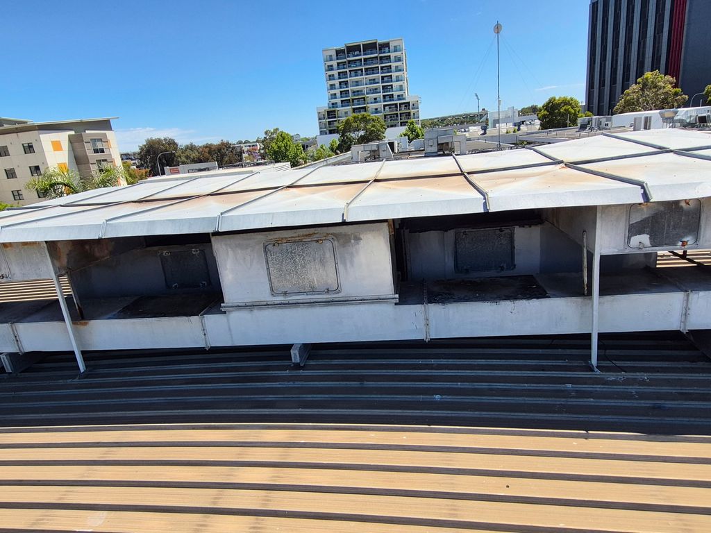 Close-up of ageing rooftop ventilation ductwork prior to HVAC upgrade.