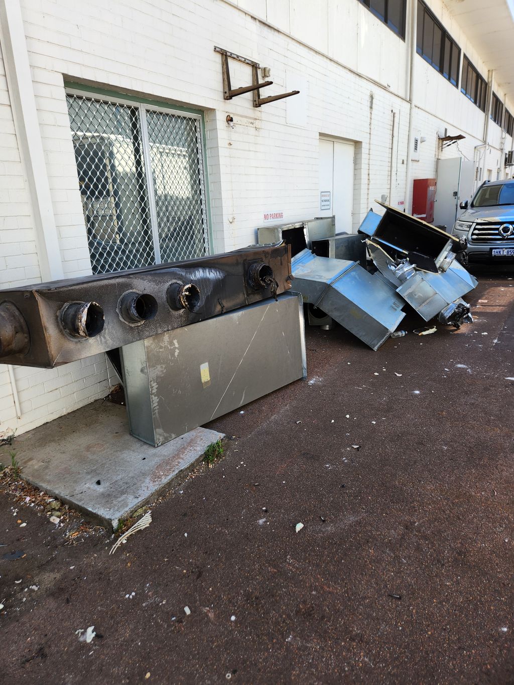 Demolished ventilation duct sections prepared for disposal after HVAC removal.