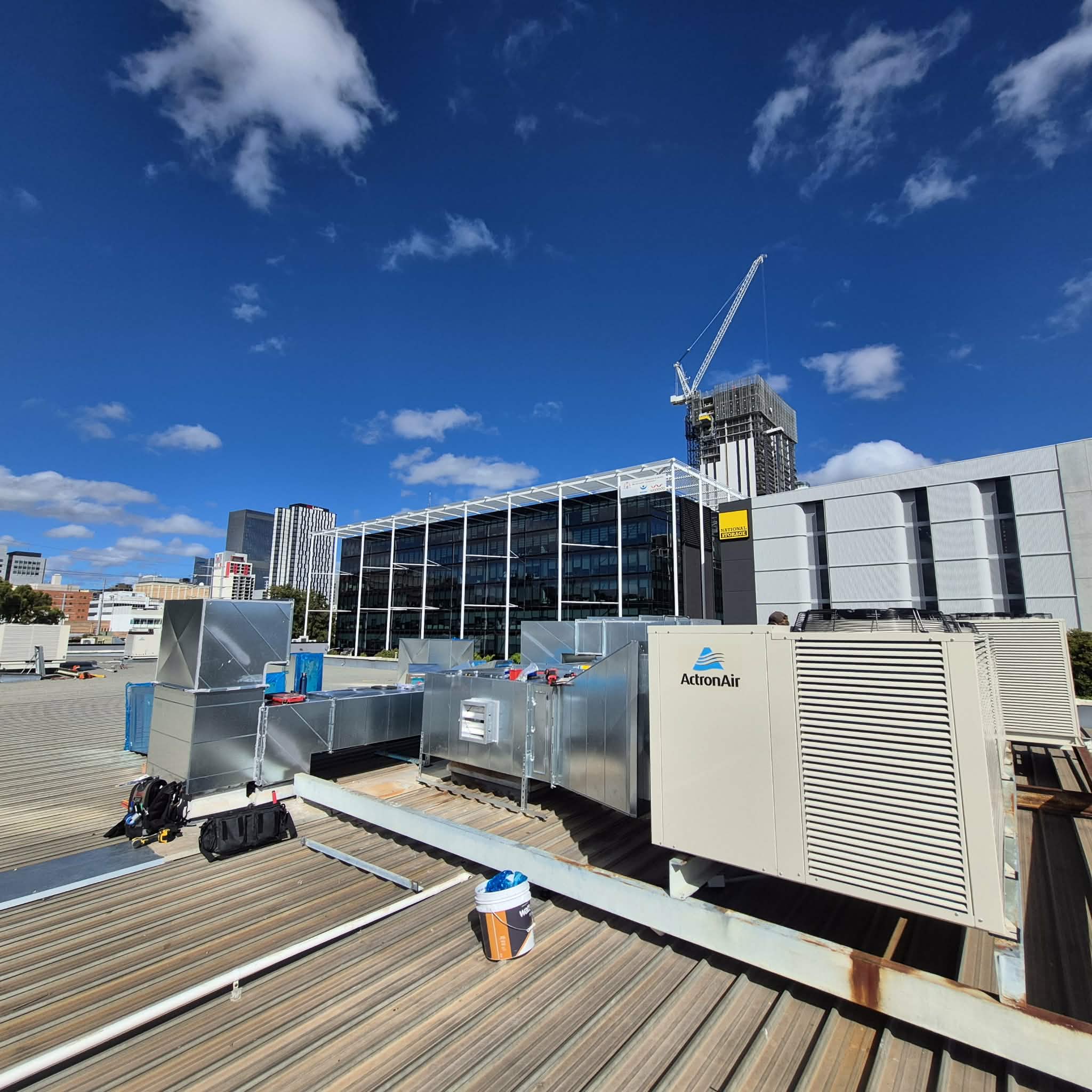 Newly installed rooftop ActronAir HVAC system with galvanised ductwork.
